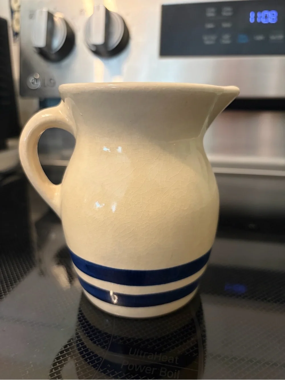 Robinson-Ransbottom Cream Ceramic Pitcher with Navy Blue Bands